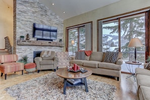 Flat-screen TV, fireplace, video games, ping pong