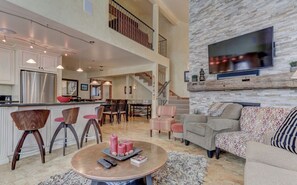 Flat-screen TV, fireplace, video games, ping pong