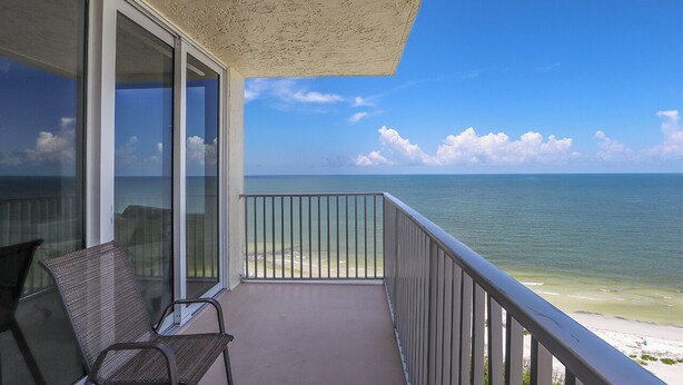 A balcony with a view of the ocean and beach. - Spectacular Deluxe Estero Beach & Tennis Beachfront Condo w/ Direct Gulf View (Fort Myers Beach)