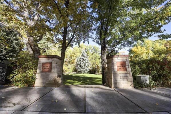 Enter a serene park setting beneath the archway of Herron Park, where the Rio Grande Trail awaits.