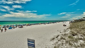 A beach with a sign indicating it is a private beach. - After Dune Delight ~ 2BR/2BA ~ 15th Floor ~ (Miramar Beach)