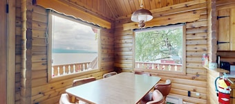 Cozy lakefront log cabin with lake views, vintage decor, & dock