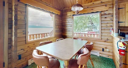 Cozy lakefront log cabin with lake views, vintage decor, & dock