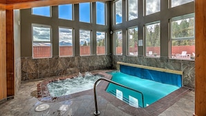 A hot tub area with a view of a wooden deck and mountains. - Fox Haven at Summerwood Neighborhood, Community Pool+Clubhouse, Private Decks (Dillon)