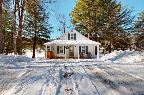 Quaint lakefront home with a fire pit and beautiful views