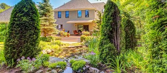 Luxurious house with golf course views, firepit, pergola, deck, and central AC