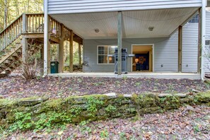 Step out onto the covered porch and enjoy the serene surroundings from the comfort of your own space.