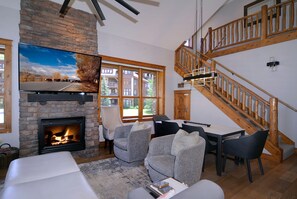 Living room, stairs to primary suite