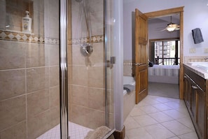 Bathtub, hair dryer, towels, shampoo
