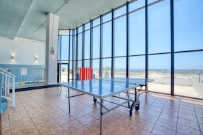 Enjoy a game of ping pong with a view of the beach from the large windows.