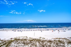 Relax on the beach with comfortable sun loungers and beach umbrellas.