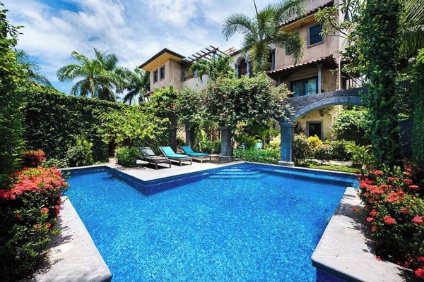 Enjoy sunny days by the serene swimming pool, shared by only 5 villas in Langosta Beach, an exclusive community next to Tamarindo, Costa Rica.