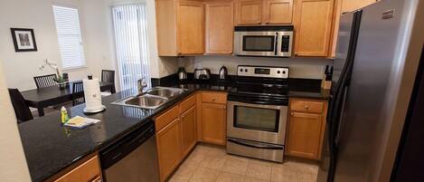 Coffee/tea maker, toaster, dining tables