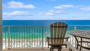 A balcony with a view of a beach and ocean. - GULF FRONT CONDO! SLEEPS UP TO 6! (Panama City Beach)