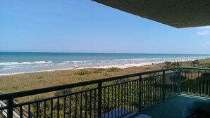 A balcony with a view of a beach and ocean. - Direct Ocean 3 bed, 3 1/2 bath (Cocoa Beach)