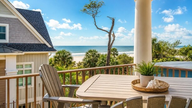 A covered outdoor seating area with a view of the beach and ocean. - 77A Dune-Awesome Ocean Views, Pool, Spa, Pool Table, Elevator & Much More (Hilton Head Island)