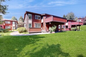 Stunning two-story residence with a beautifully maintained lawn and driveway.