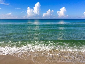 On the beach, sun-loungers, beach towels