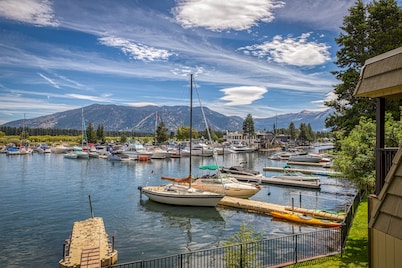 Two-story lakefront condo with access to dock, hot tub, pool & tennis