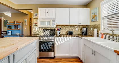 Updated Dog-Friendly Cottage with Outdoor Firepit, Five Blocks from the Beach