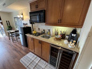 Fridge, microwave, stovetop, coffee/tea maker