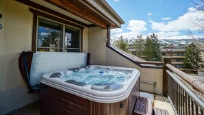 A hot tub on a balcony with a mountain view. - Corral at Breckenridge Raven Condo: Soaking Tub, Views (Breckenridge)