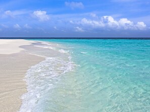 A beach with clear turquoise water and white sand. - Charming Beach Bungalo w/ 2 GOLF CARTS! Screened Porch, Loft, Near Pool+Wharf (Destin)
