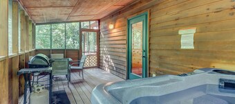 Spacious Dog-Friendly Cabin with Screened Deck, Private Hot Tub, & Firepit
