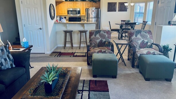 A compact living space with a kitchen, dining area, and seating. - Crow's Nest by Mesquite Vacation Rentals: Stunning Views of Mesquite and $510 in free daily activities (Mesquite)
