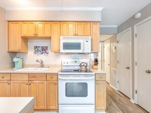 Fridge, microwave, stovetop, coffee/tea maker