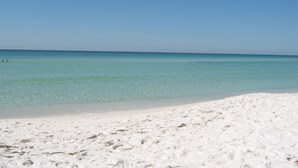 A beach with clear turquoise water and white sand. - Golf Cart, Pet-friendly, Linkside Village 414 (Miramar Beach)
