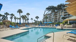 A pool area with lounge chairs, a no diving allowed sign, and a building with balconies. - 1 Bedroom/2 Bathroom 3rd Floor Oceanfront End Unit Condo with Amazing Views!! (Hilton Head Island)