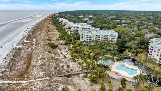 A beachfront hotel with multiple buildings, a swimming pool, and a beach. - 1 Bedroom/2 Bathroom 3rd Floor Oceanfront End Unit Condo with Amazing Views!! (Hilton Head Island)