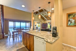 Enjoy cooking in this well-equipped kitchen with a dishwasher and large island with seating.