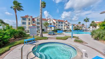 A heated pool, sun loungers