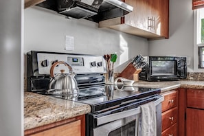 Coffee/tea maker, fridge, microwave, oven