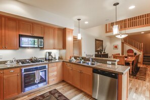 Enjoy cooking in this well-equipped kitchen with an oven, microwave, and dishwasher, plus a large island with a sink.