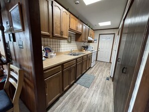 Fridge, microwave, stovetop, cookware/dishes/utensils