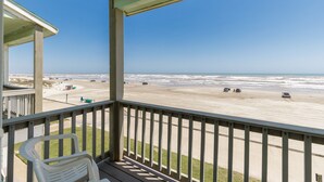 A balcony with a view of the beach and ocean. - Beachfront Condo | Stunning Views, Private Balconies & Pool (Corpus Christi)