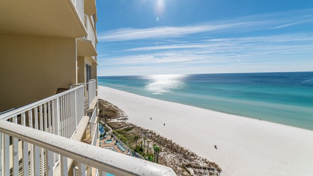 A balcony with a view of a beach and ocean. - Boardwalk 1111 4BR/3BA PCB Beachfront Luxury (Panama City Beach)
