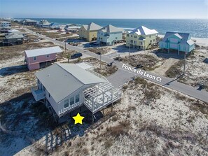 An aerial view of a coastal area with houses and a beach. - Ft. Morgan Cottage | Gulf View | Dog Friendly (Gulf Shores)