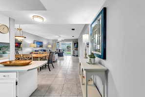 Relax in this inviting living area with a dining table, TV, and comfortable seating.
