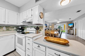 Enjoy cooking and dining in this well-equipped kitchen with a central island and adjacent dining area.