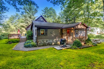 Homey getaway among the trees with bar, foosball table, hot tub, deck & firepit
