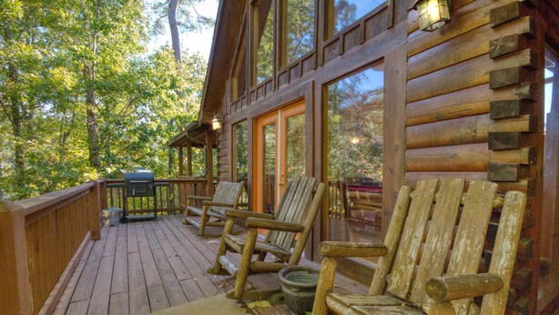 A wooden deck with outdoor seating and a grill. - View of Dollywood’s Fireworks|Pool Table|Hot Tub (SEVIERVILLE)