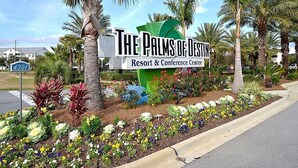 A sign for The Palms of Destiny Resort & Conference Center with a landscaped garden in front. - Paradise at the Palms * Summer Specials! Book Now! 2 King Beds~2 Full Baths! (Destin)