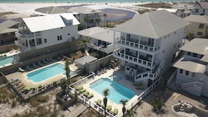 A resort with multiple buildings, a pool area, and a beach view. - Seaspray 7bed7.5B, Grayton, pool,Gulf /Lake view,DOCK,playroom!Red Bar! (Santa Rosa Beach)