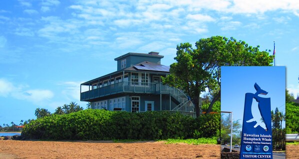 A building with a sign for the Hawaiian Islands Humpback Whale National Marine Sanctuary Visitor Center.