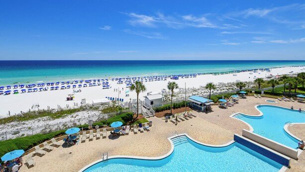 A resort with a swimming pool, beach area, and beach umbrellas. - Comfortable Beachfront Condo w/ Easy Beach Access in Central Destin! 🏖☀🌴 (Destin)