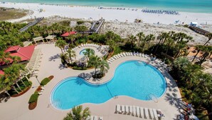 An aerial view of a resort with a large pool, beach access, and palm trees. - 1BR w/ Beach Views! Spacious Balcony, Tropical Pool, Tiki Bar, Hot Tub, Tram. (Miramar Beach)